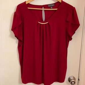 Red blouse with bar necklace accent flutter sleeve and keyhole back with button